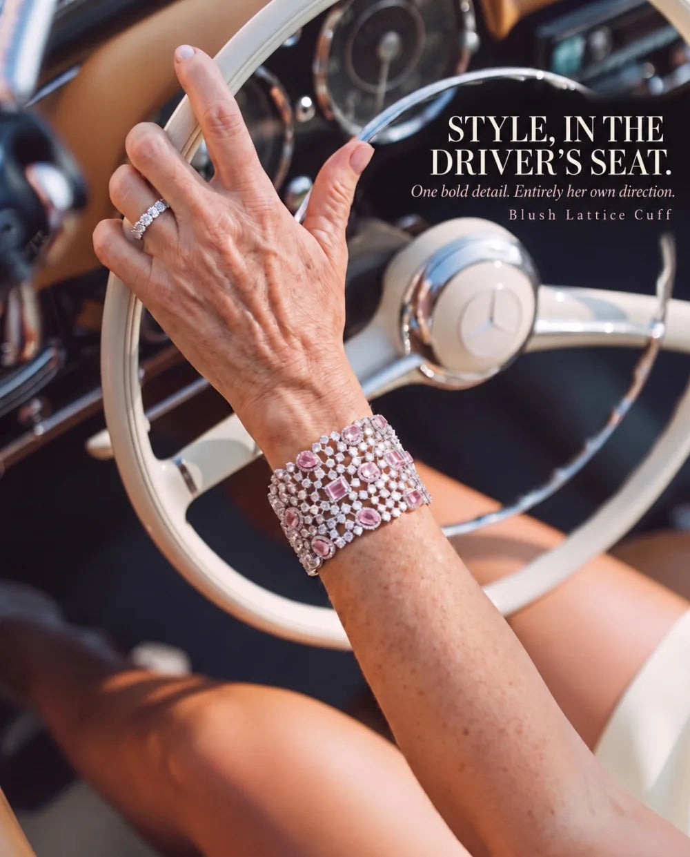 Blush Lattice Cuff worn at a vintage steering wheel. The photograph reads: Style, in the driver’s seat.